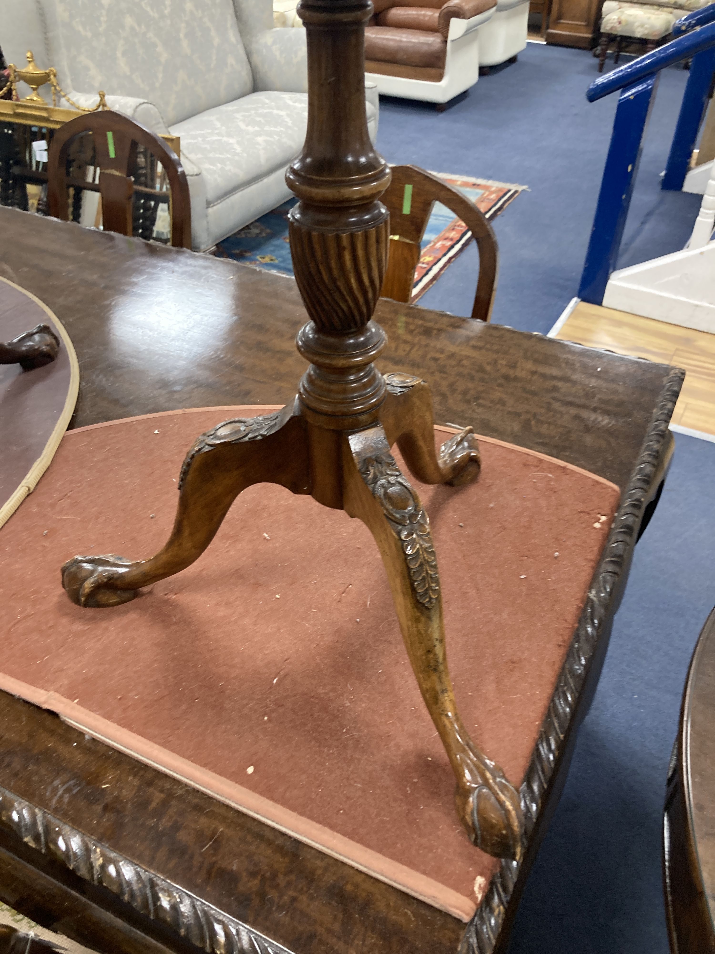 A pair of reproduction George III style mahogany galleried tripod wine tables, 48cm diameter, height 63cm